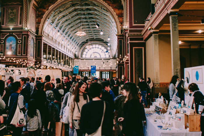 Group of people attending an exhibition