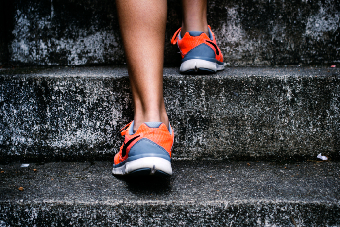 A lady training and climbing the stairs